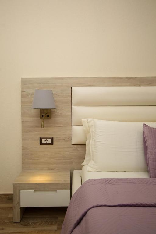 Postel nebo postele na pokoji v ubytování Hotel VD Roleks