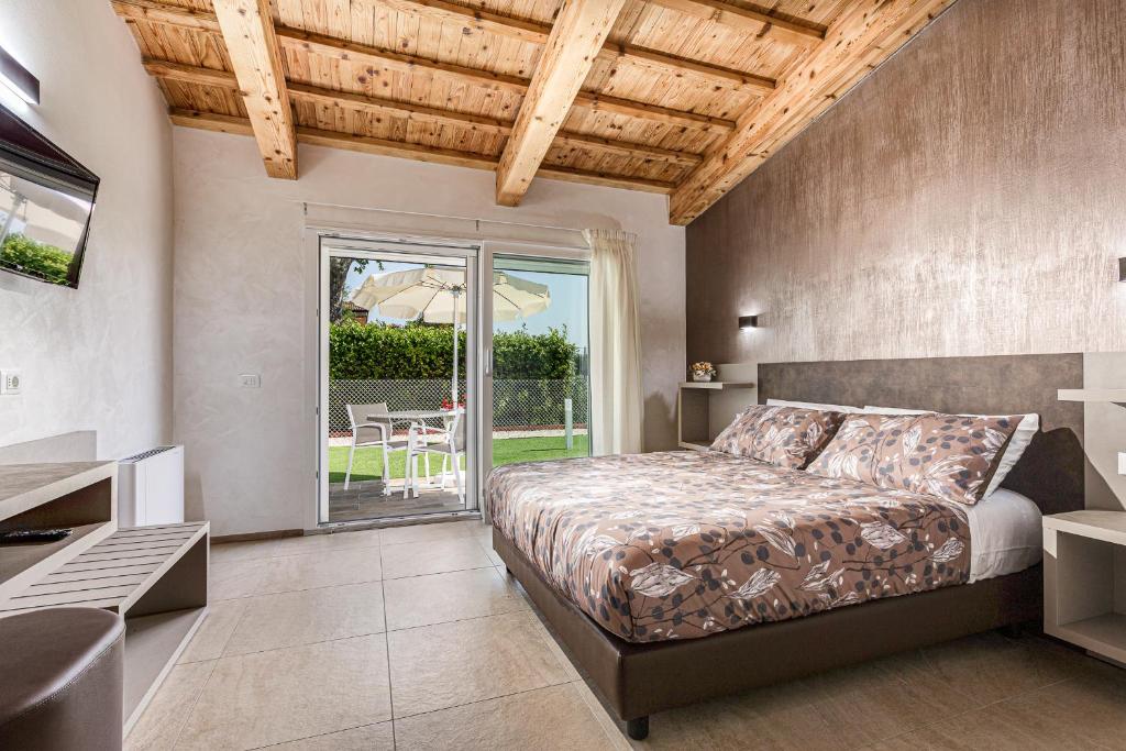 Postel nebo postele na pokoji v ubytování I Delfini - Natural B&B