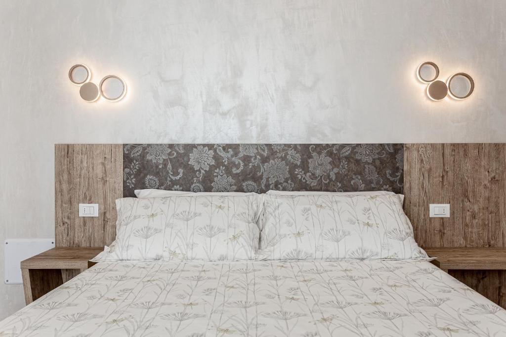 Postel nebo postele na pokoji v ubytování I Delfini - Natural B&B