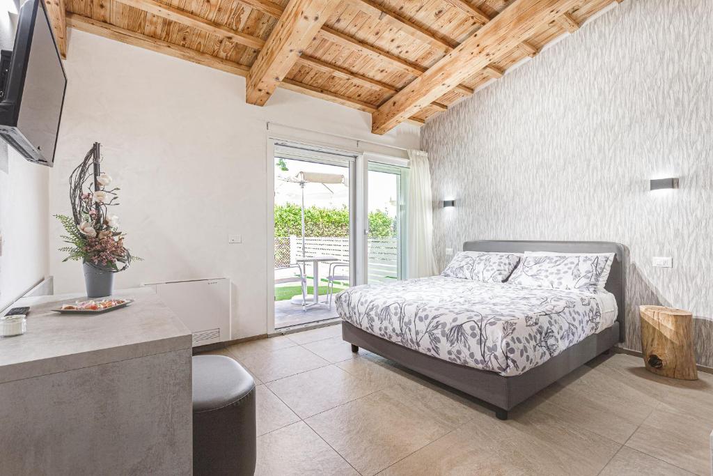 Postel nebo postele na pokoji v ubytování I Delfini - Natural B&B