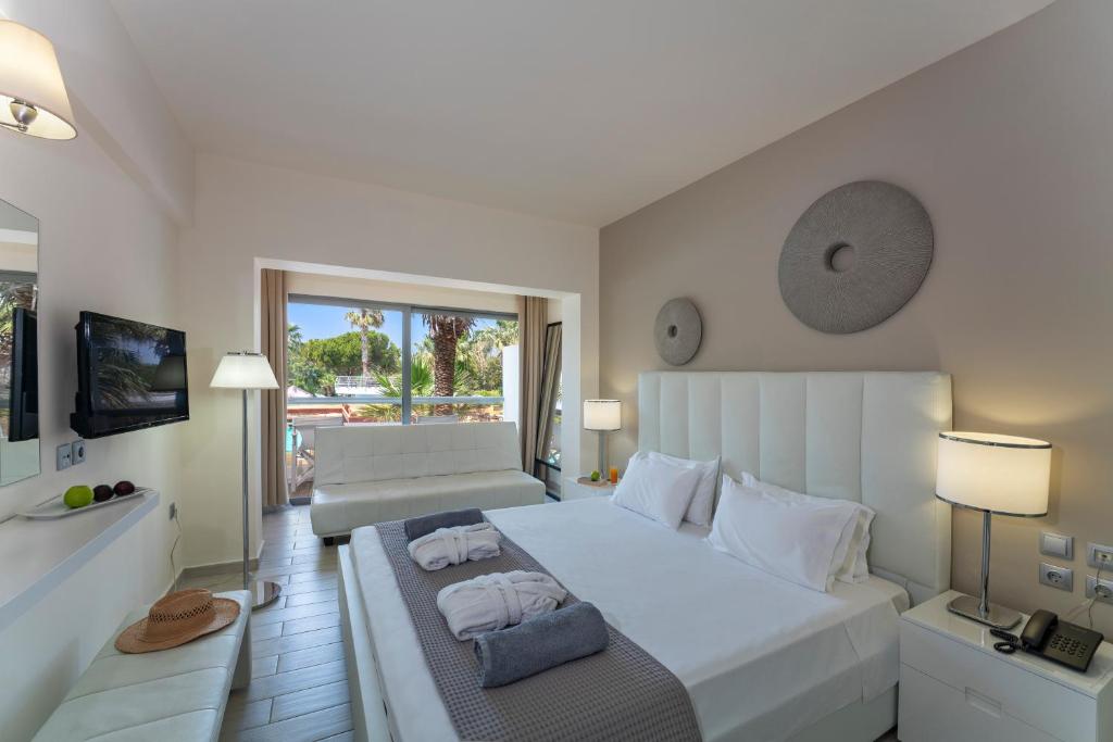 A bed or beds in a room at All Senses Ocean Blue Sea Side Resort - All Inclusive