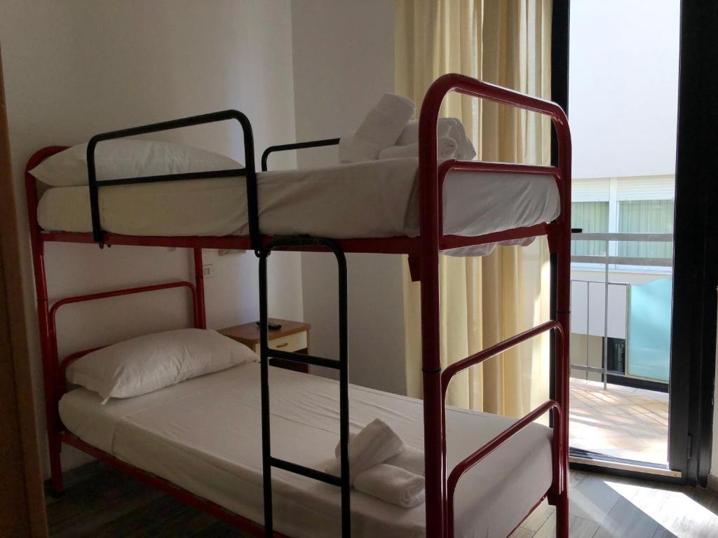Postel nebo postele na pokoji v ubytování Vinsea Hotel