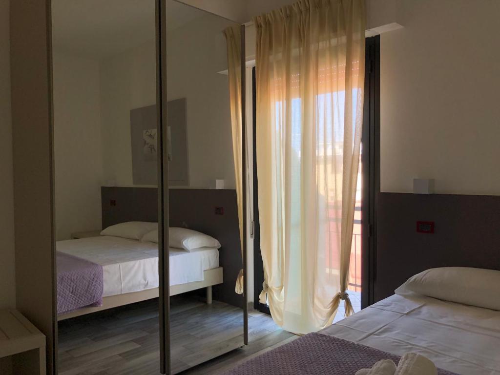 Postel nebo postele na pokoji v ubytování Vinsea Hotel