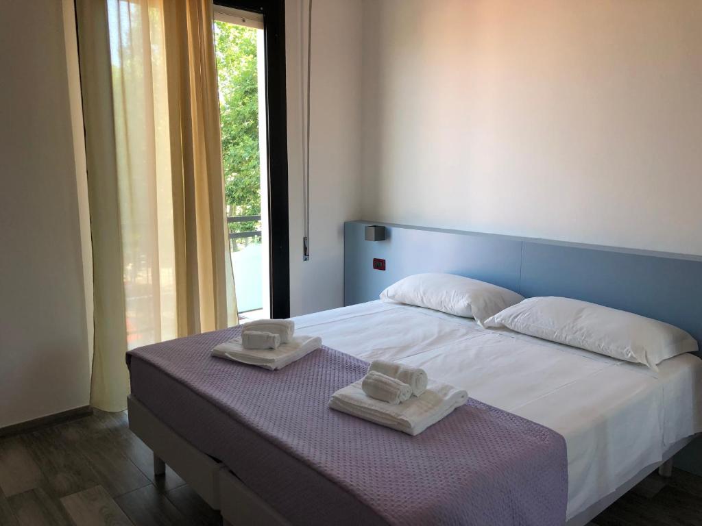 Postel nebo postele na pokoji v ubytování Vinsea Hotel