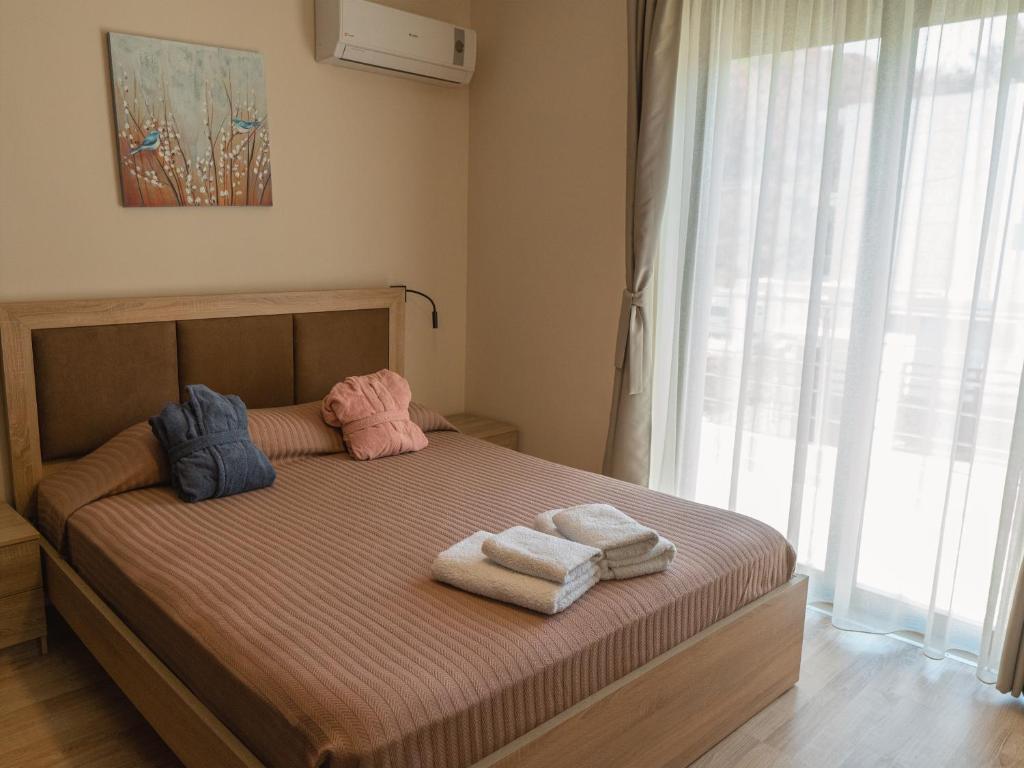 Postel nebo postele na pokoji v ubytování Adonis Villa in nature