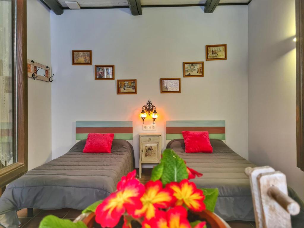 Postel nebo postele na pokoji v ubytování Albergue El Encanto