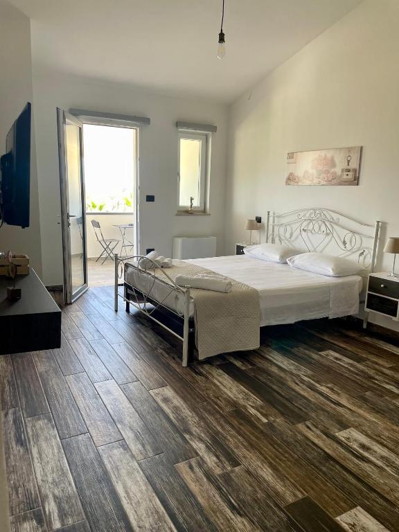 Postel nebo postele na pokoji v ubytování Elios Rooms