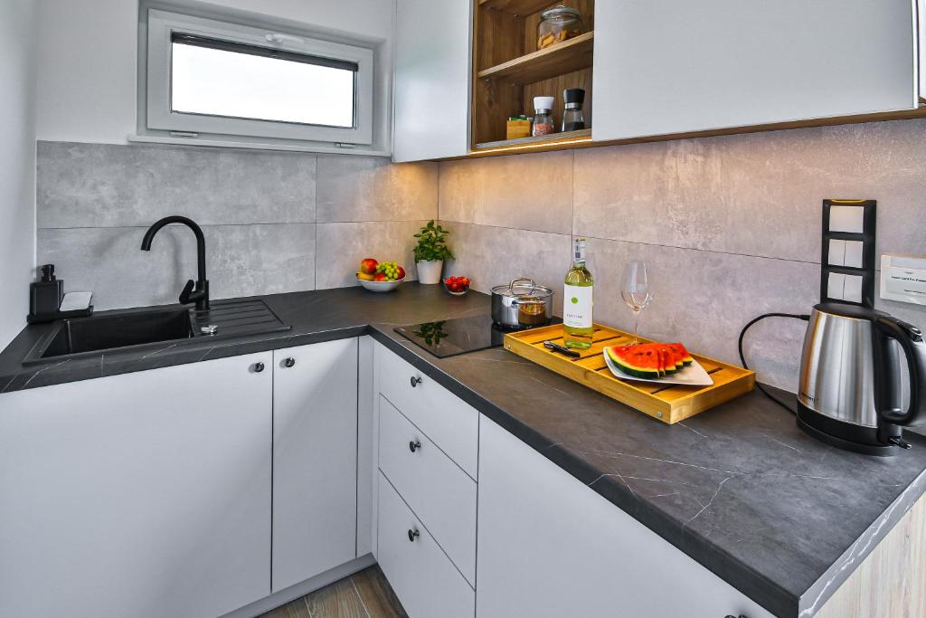 Kuchyň nebo kuchyňský kout v ubytování Klif Resort Apartamenty