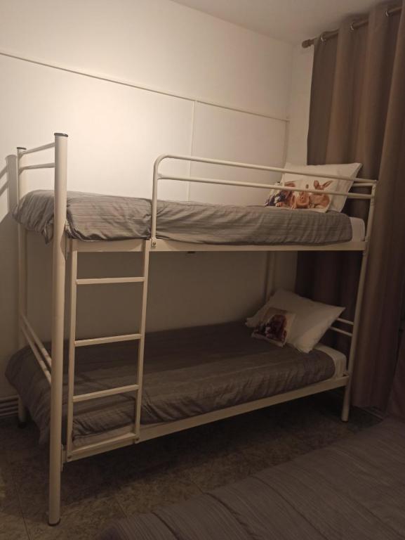 A bed or beds in a room at Alexander Apartments Nea Koutali