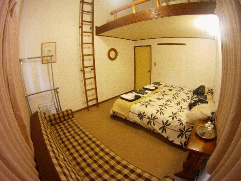 Postel nebo postele na pokoji v ubytování Chalet Myoko