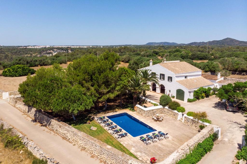 an aerial view of a house with a swimming pool at Villa Rafal Fort in Alaior