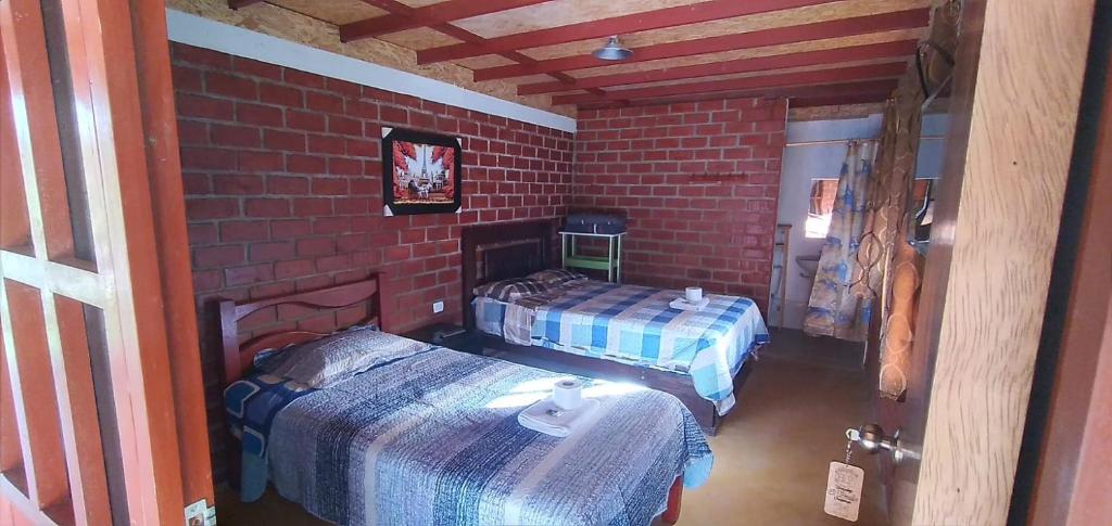 Tempat tidur dalam kamar di Casa Hospedaje el Prado Eco turismo