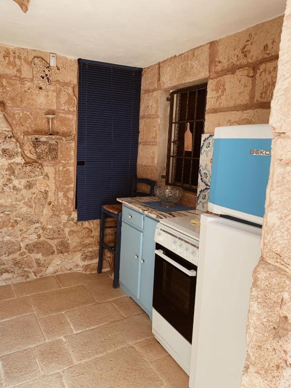Kuchyň nebo kuchyňský kout v ubytování Trullo Contrada Stracca