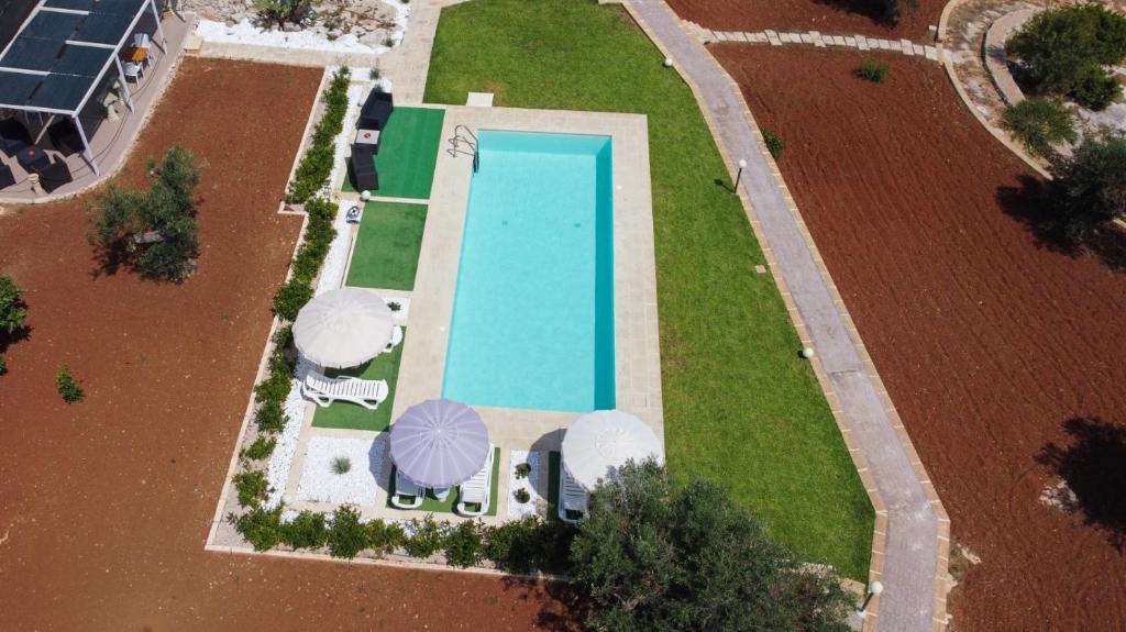 an overhead view of a swimming pool in a field at Villa Stella in Marina di Pescoluse