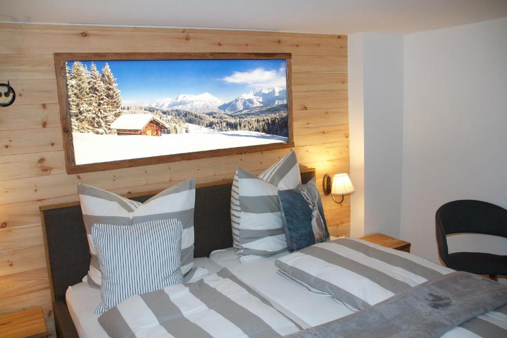 a bedroom with a bed with a view of a snowy mountain at Ferienwohnung Lechraum in Landsberg am Lech in Landsberg am Lech