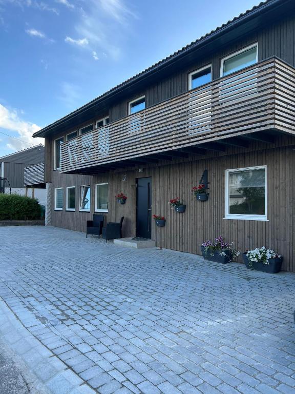 a house with a balcony on the side of it at Vadlåsveien 4 in Egersund