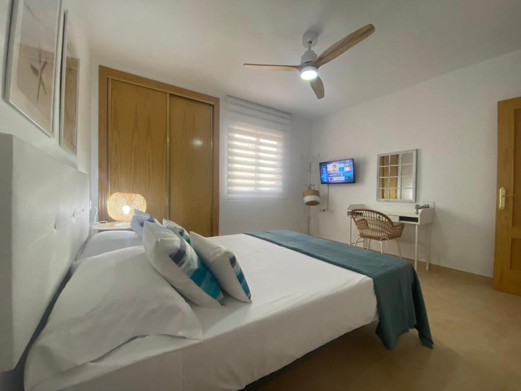 Säng eller sängar i ett rum på CABO BEACH II