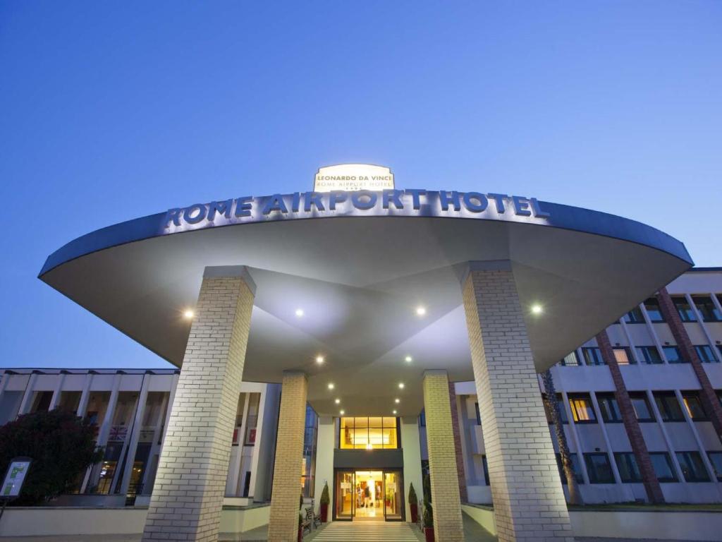 a building with a sign that reads lone apartment house at Mercure Leonardo da Vinci Rome Airport in Fiumicino