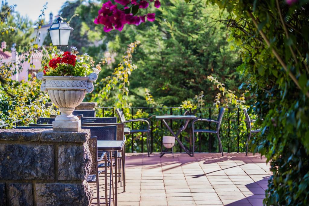 Um jardim em Casa Vela Boutique House