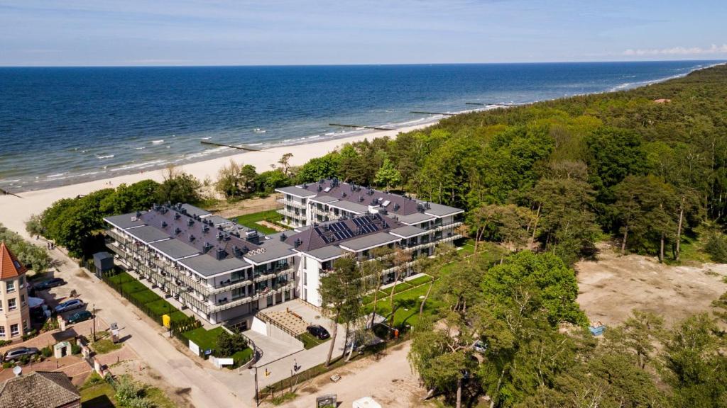 an aerial view of a building on the beach at e-baltic - Niechorze in Niechorze