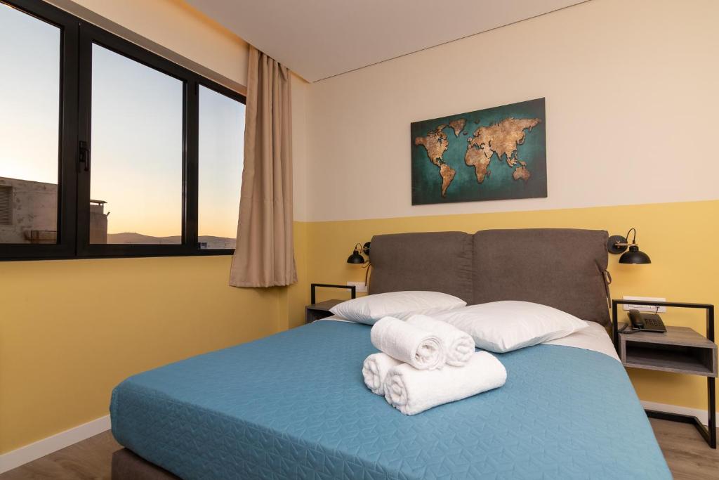 Postel nebo postele na pokoji v ubytování Dunlin Hotel