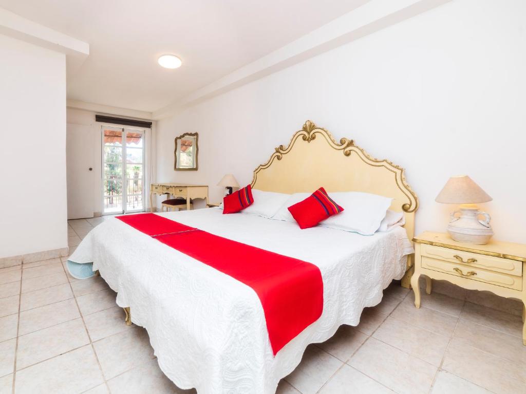 Postel nebo postele na pokoji v ubytování Los Pueblitos de Guanajuato Hotel