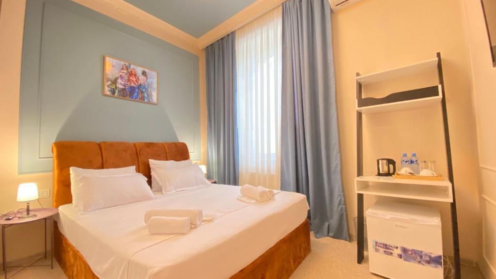 Postel nebo postele na pokoji v ubytování Mose art Hotel