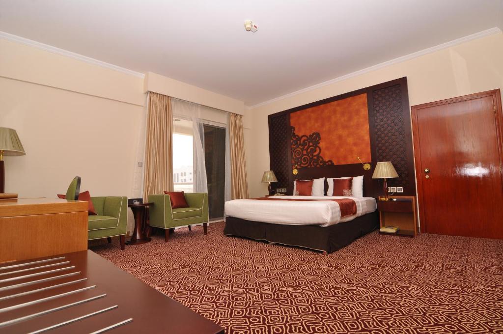 Postel nebo postele na pokoji v ubytování Dubai Grand Hotel by Fortune, Dubai Airport