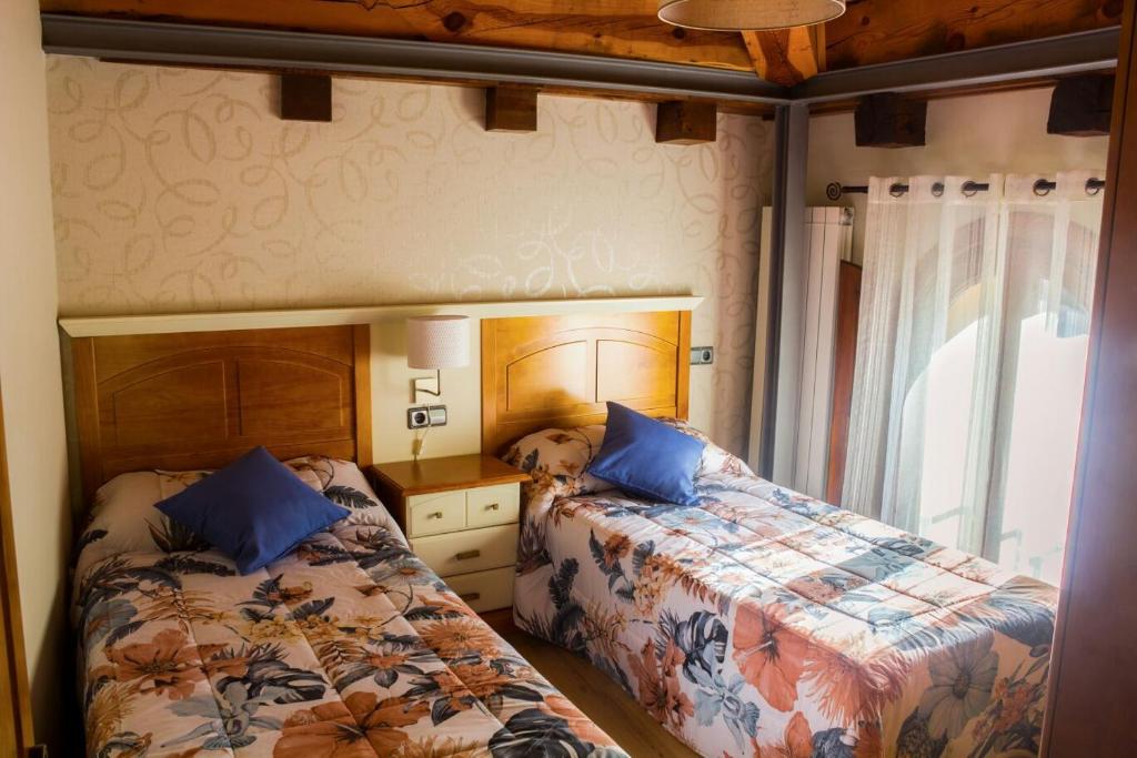 Un pat sau paturi într-o cameră la La Casa del Abad