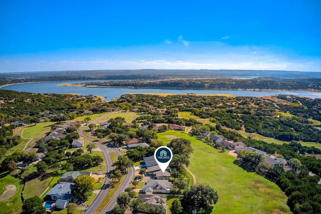 an aerial view of a suburb with a road and houses at Lago Vista Sunset Villa in Lago Vista