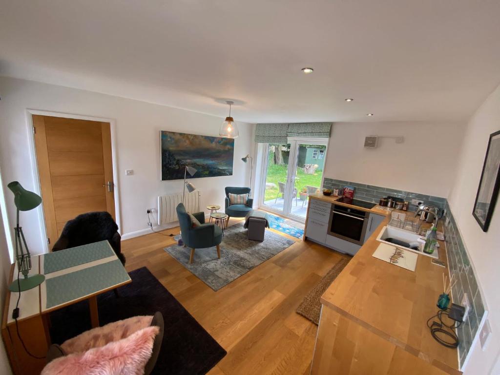 an aerial view of a living room with a kitchen at Self-contained, ground floor apartment with parking and patio in Walmer