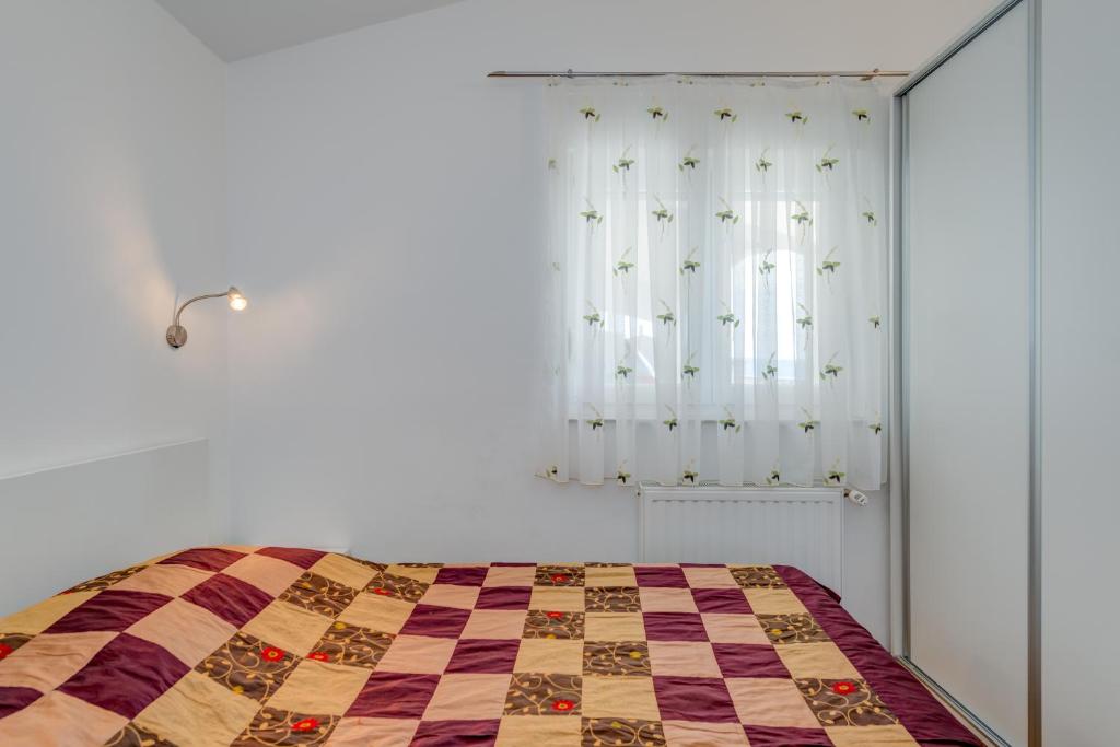 Postel nebo postele na pokoji v ubytování Pikolo Apartments Omiš