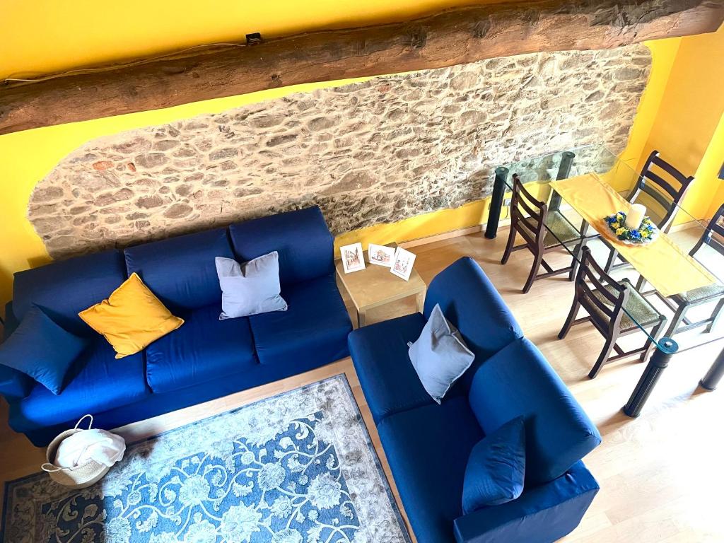 an overhead view of a living room with a blue couch at Il Fienile in Garessio