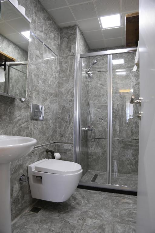 Koupelna v ubytování Arat Apartments