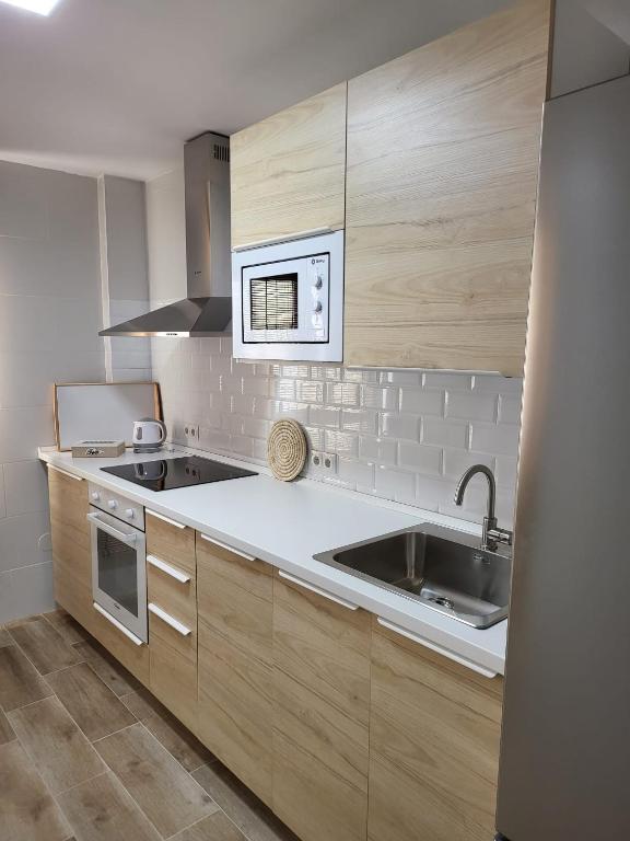 Kuchyňa alebo kuchynka v ubytovaní APARTAMENTO SH