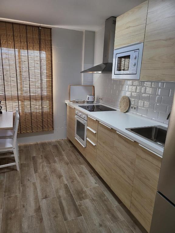 Kuchyňa alebo kuchynka v ubytovaní APARTAMENTO SH