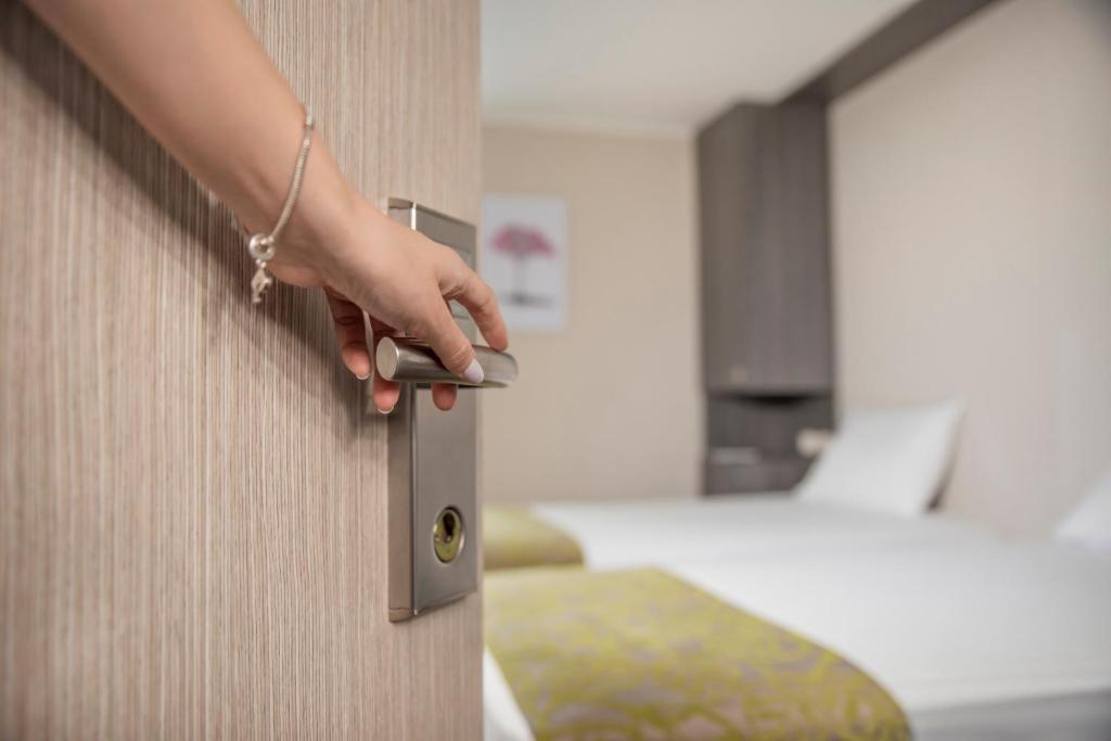 Postel nebo postele na pokoji v ubytování Eco Star Hotel