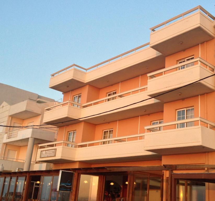 a building with balconies on the side of it at 4 Brothers in Rhodes Town