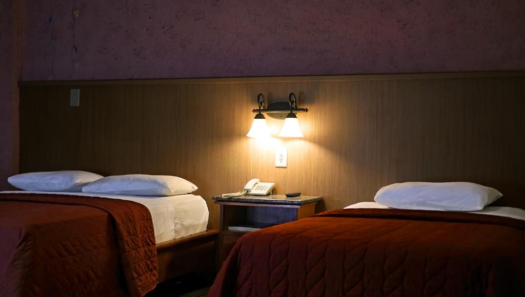 Voodi või voodid majutusasutuse Hotel Castilla toas