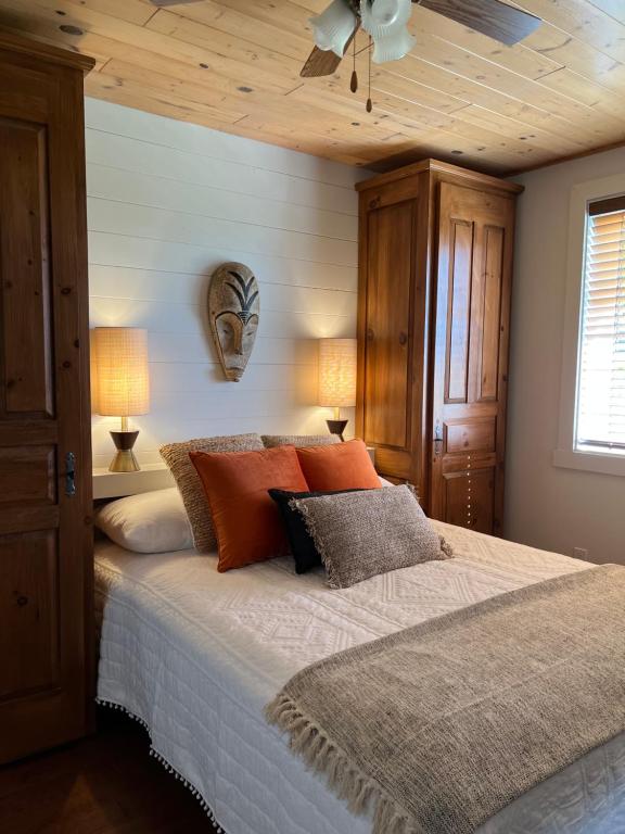 Ein Bett oder Betten in einem Zimmer der Unterkunft Paradis de Charlevoix - Loft