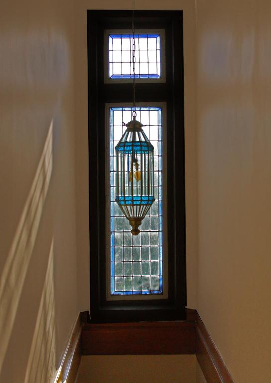 a window with a chandelier in front of it at Hotel Boutique Casa Conde in Santiago