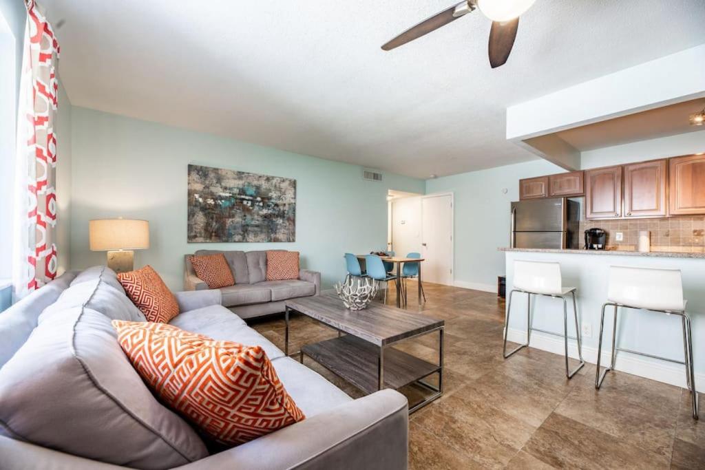 a living room with a couch and a table at Steps to Sand and Sea 4 in Fort Lauderdale