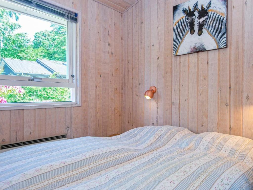 Postel nebo postele na pokoji v ubytování 8 person holiday home in Glesborg-By Traum