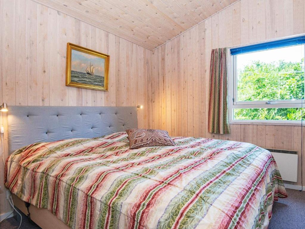 Postel nebo postele na pokoji v ubytování 8 person holiday home in Glesborg-By Traum