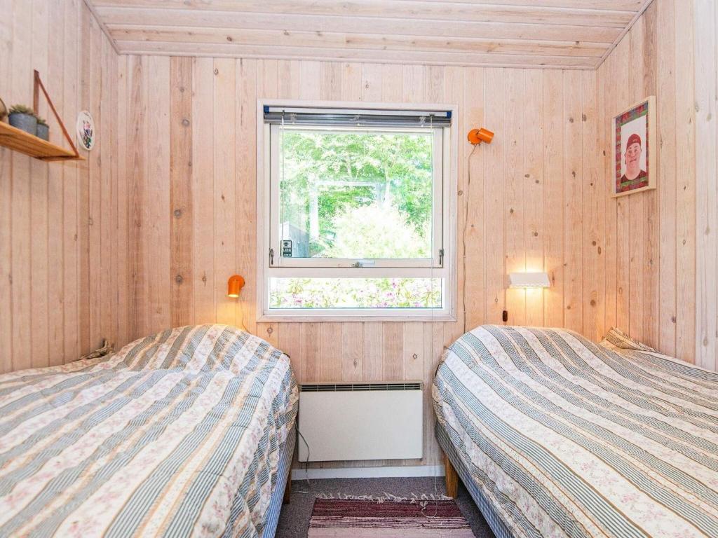Postel nebo postele na pokoji v ubytování 8 person holiday home in Glesborg-By Traum