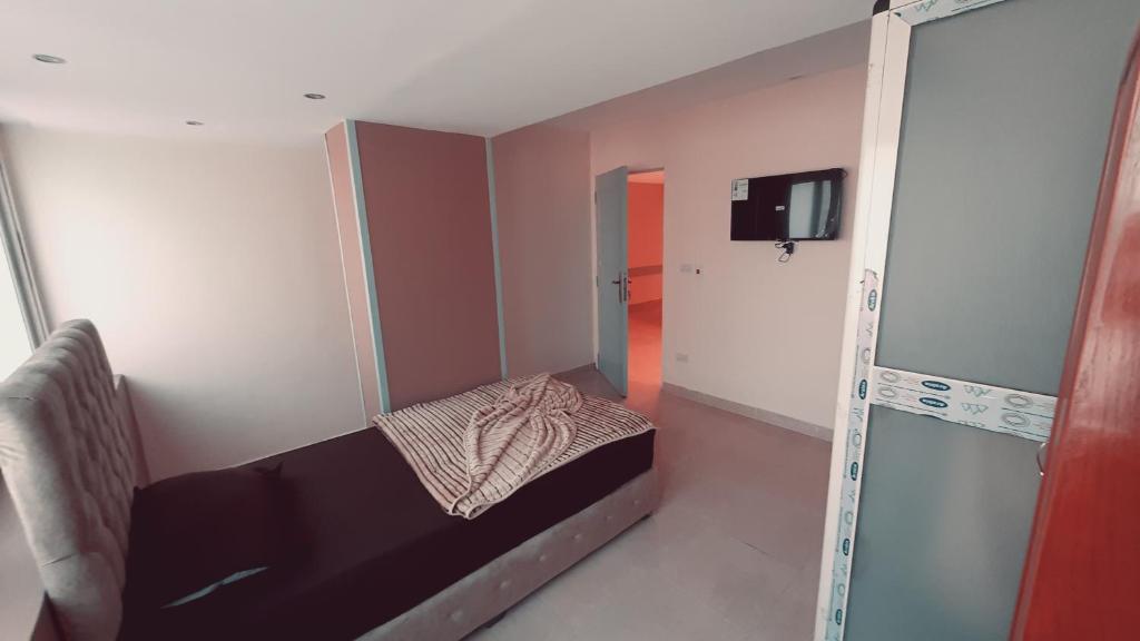 TV a/nebo společenská místnost v ubytování Blue Eyes Hotel