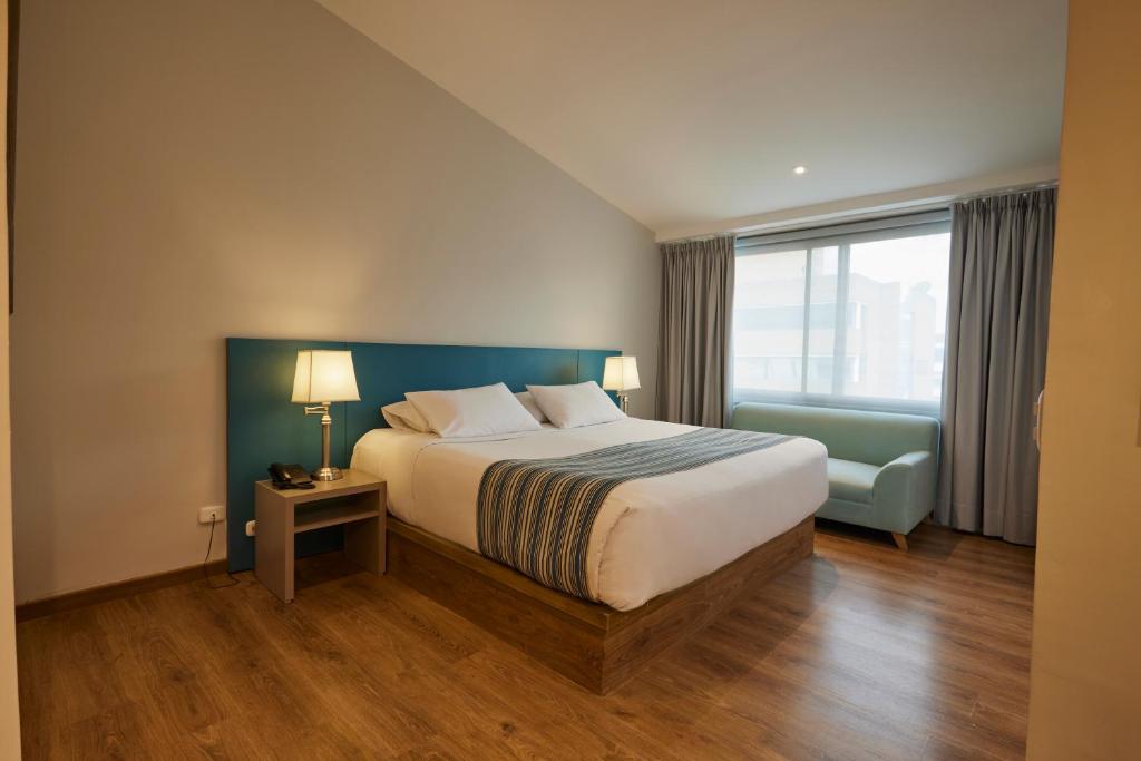 Postel nebo postele na pokoji v ubytování Hotel Saint Simon
