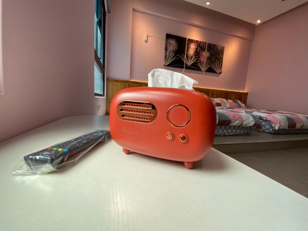 Postel nebo postele na pokoji v ubytování 珊號旅店 3inn
