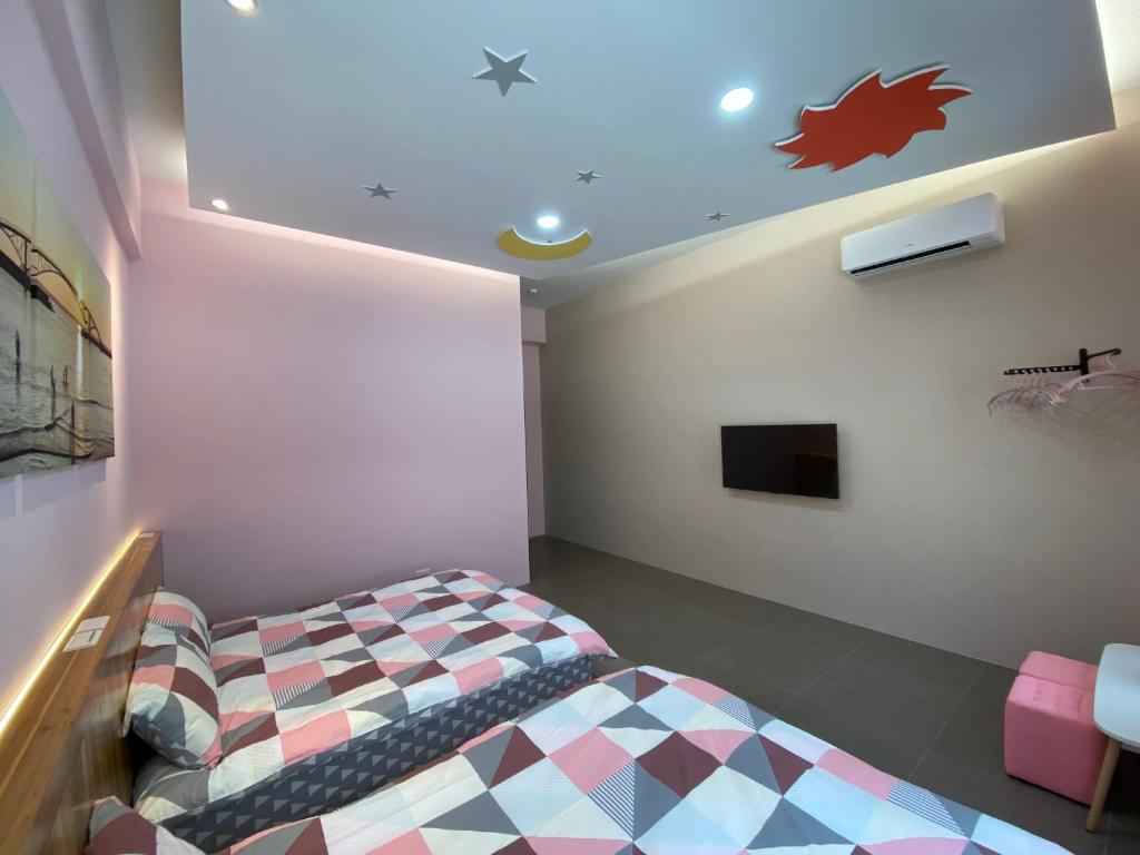 Postel nebo postele na pokoji v ubytování 珊號旅店 3inn