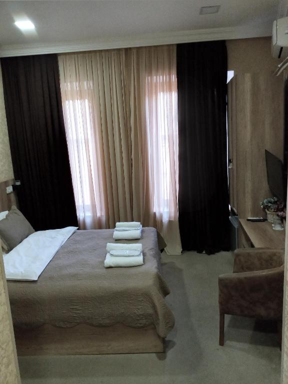 Postel nebo postele na pokoji v ubytování Epic Meidan Hotel